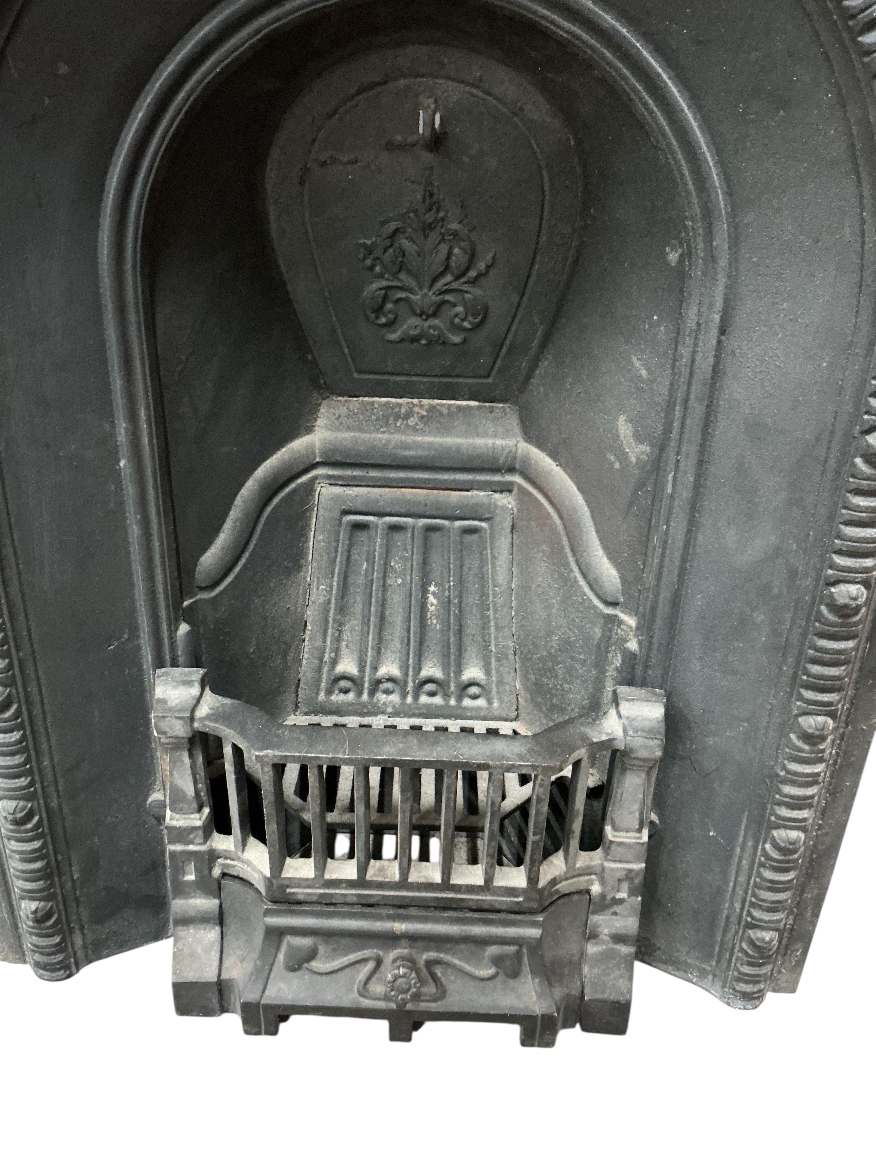 A Victorian cast iron fireplace, width 61cm, height 92cm